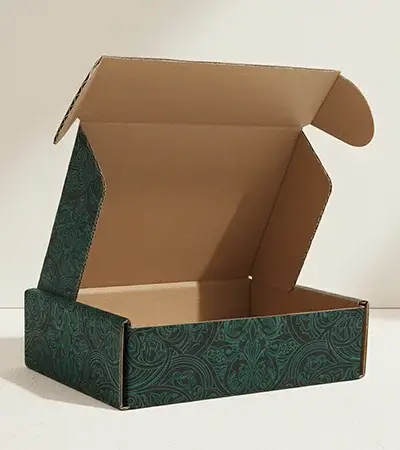Corrugated mailer box with reinforced edges