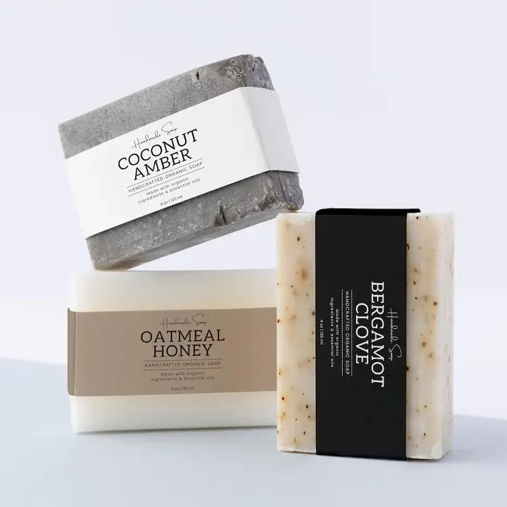 Custom printed cardboard sleeves wrapped around artisanal soap bars